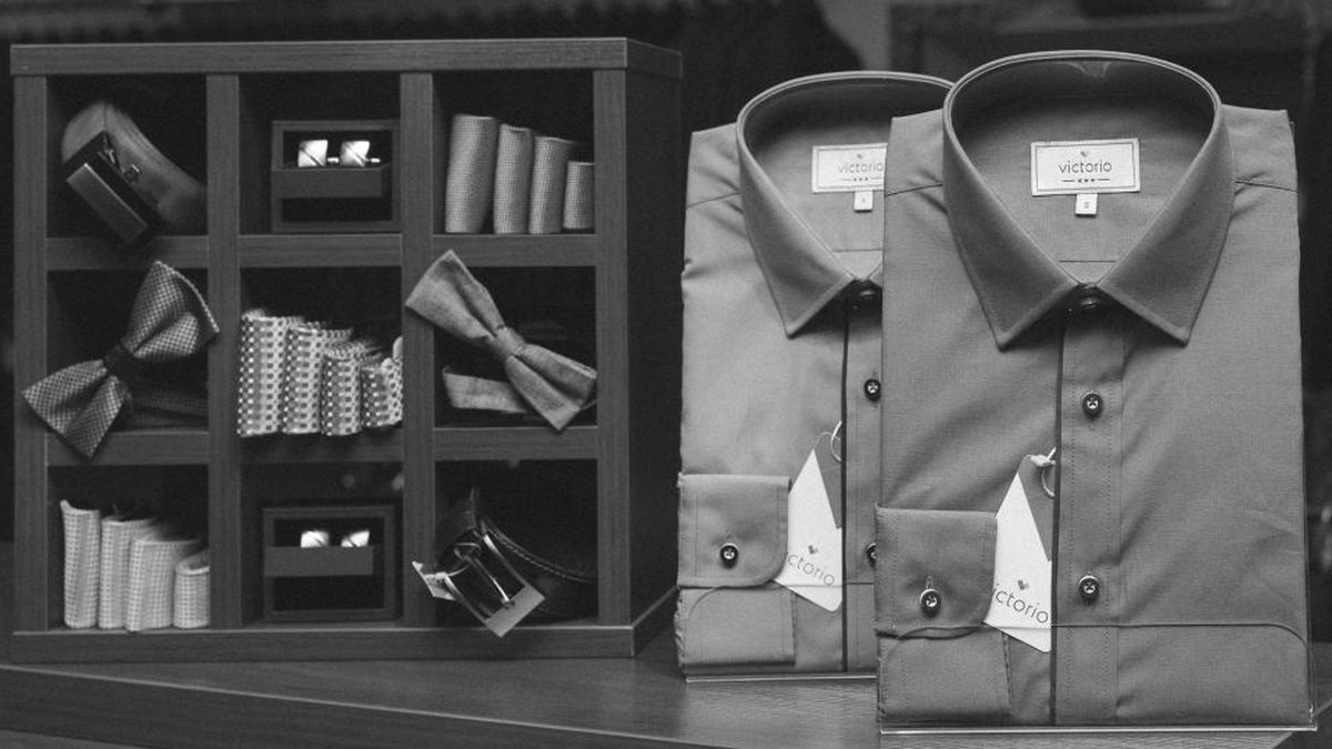 Branded collared shirts displayed on a retail shelf